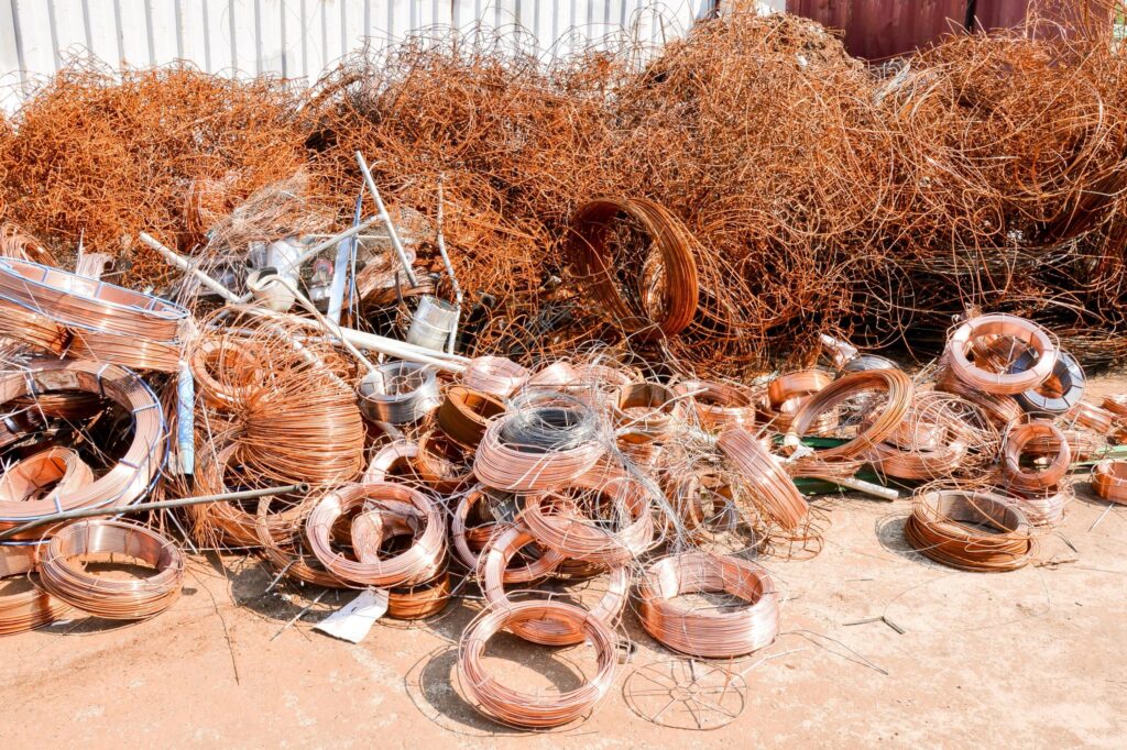 Clean copper wire and copper pipes at a professional scrap recycling yard.
